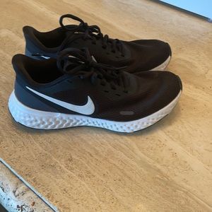 Black Nike Revolution shoes